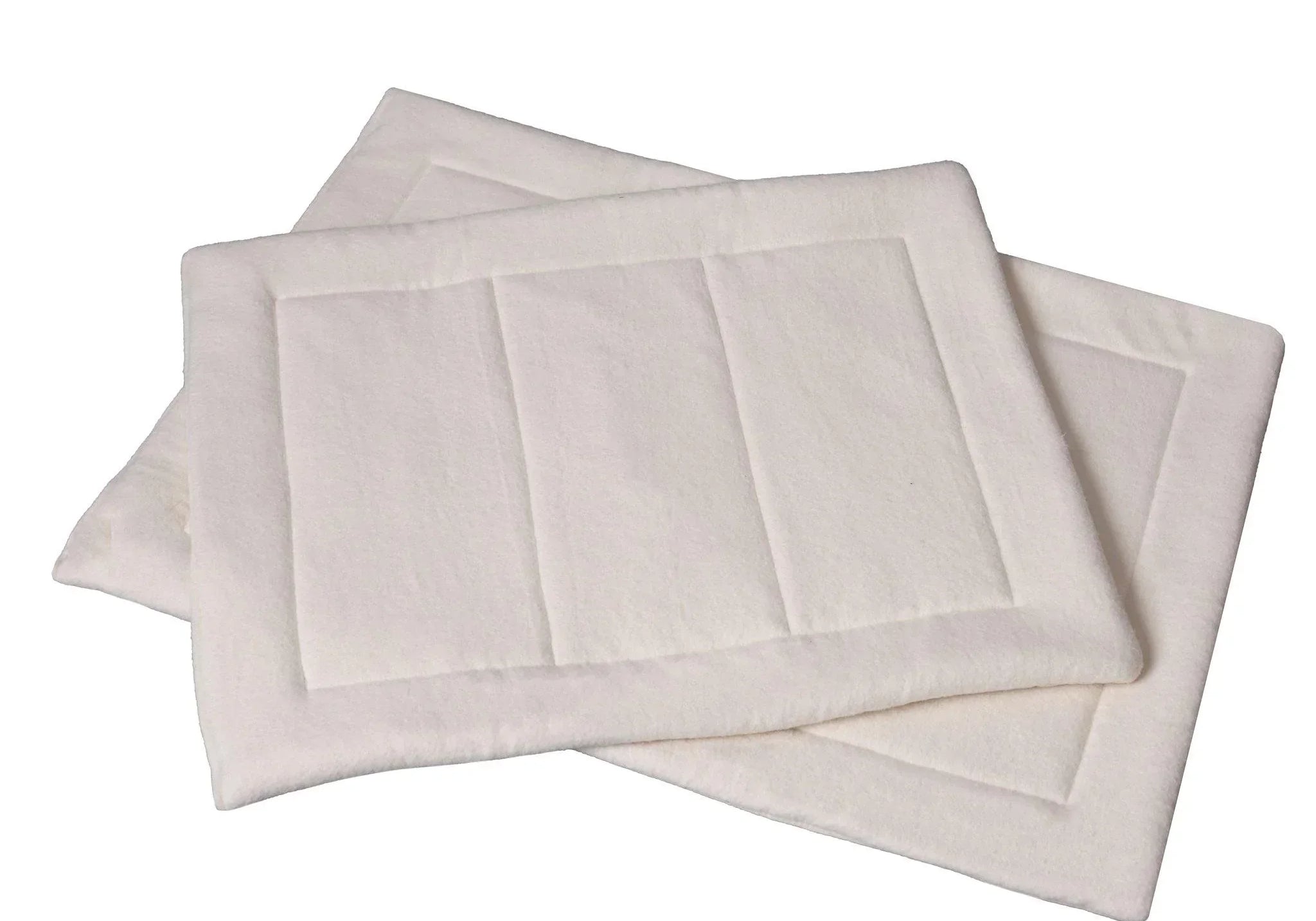 two overlapping natural cotton fleece dog mats