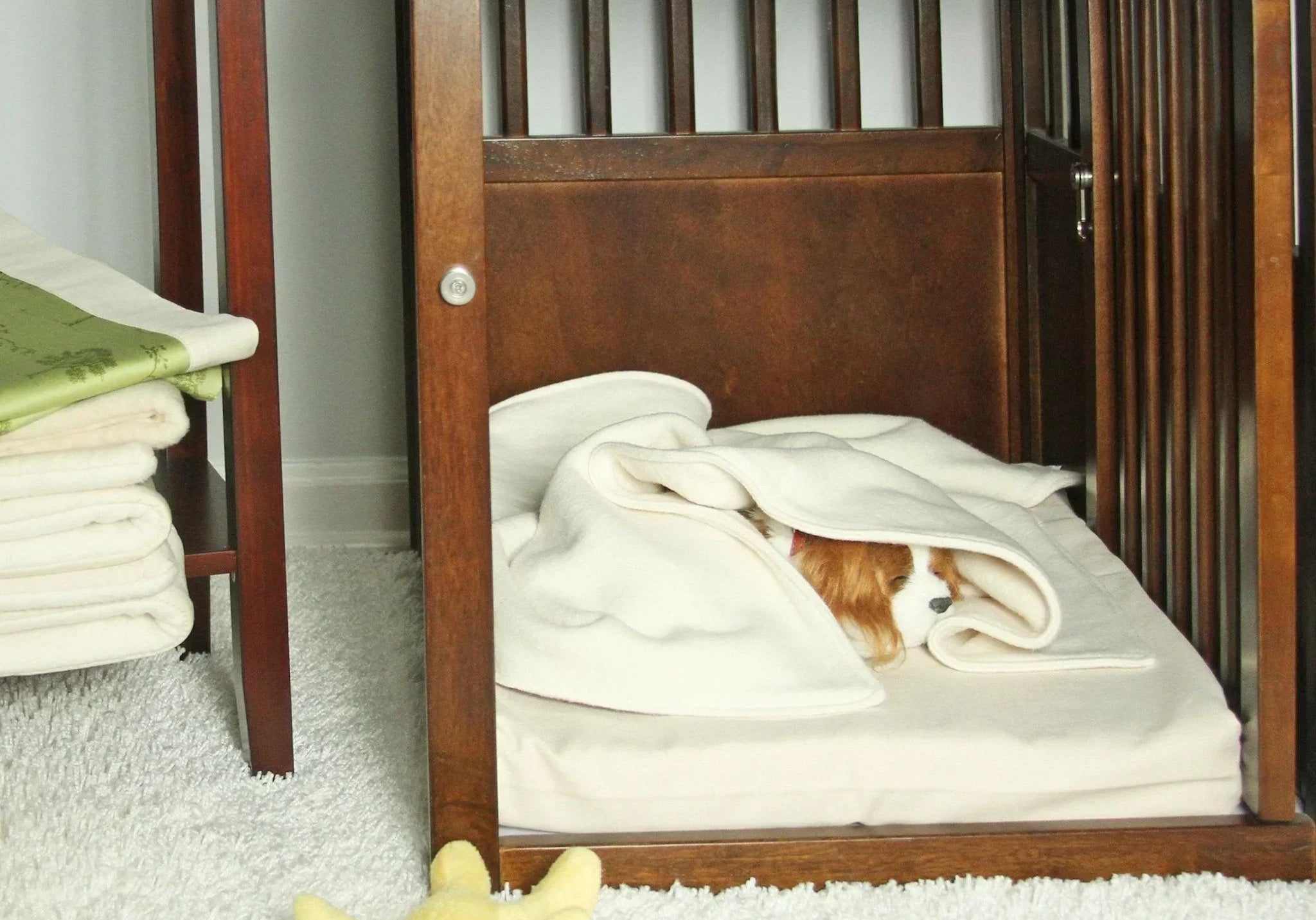 puppy sleeping on organic dog mat in crate