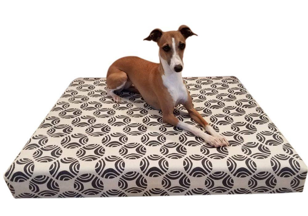 small dog on grey and natural dog bed cover