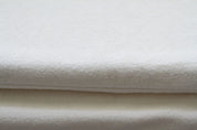 two dog mats covers in natural fleece close up