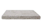 front view of a tan and beige dog bed cover