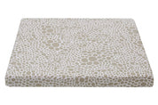 top view of tan and beige dog bed cover