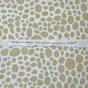 organic cotton fabric close up white and tan pattern