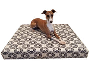 small dog on grey and natural dog bed cover
